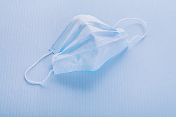 Obraz premium disposable face mask on blue background