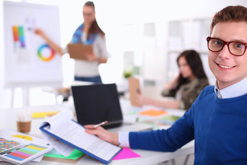 Young business people working at office on new project