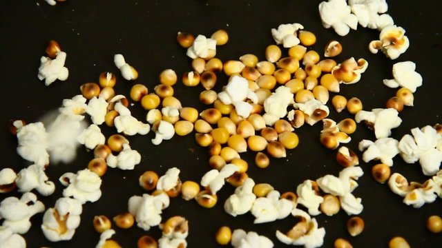 homemade popcorn cooking in slow motion in a pan