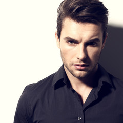 Obraz premium Fashion portrait of young man in black shirt