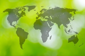 World map on the green blur background.