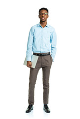 Fototapeta premium Happy african american college student standing with laptop on w