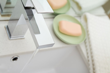 Overhead view of a contemporary mixer bathroom tap and accessori