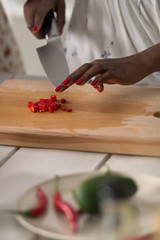 Young African Woman Cooking Salad