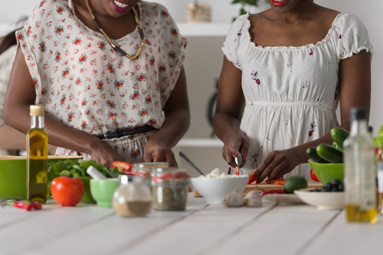 Two African Women Cooking Salad