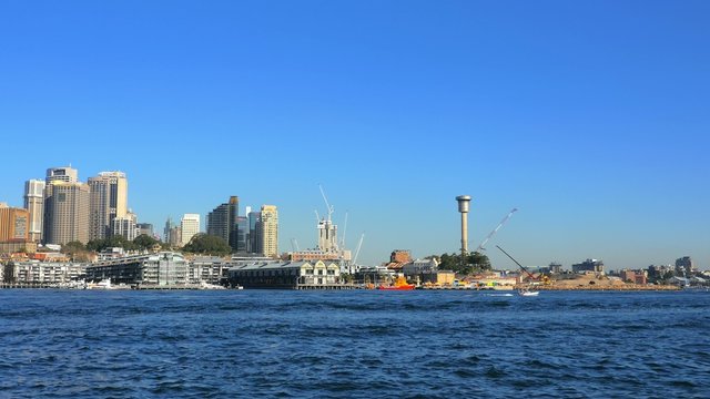 Panning shot of Sydney Harbor, CBD and Sydney Harbor Bridge