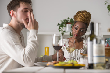 Fototapeta na wymiar Multiracial Couple Enjoying Meal