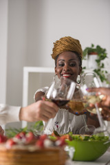 Young Friends Enjoying Meal at Home © Milles Studio