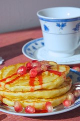 Sweet cottage cheese cakes with red topping