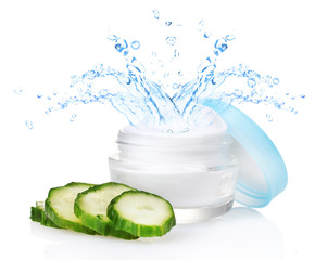 Cream with water splashing and fresh sliced cucumber isolated