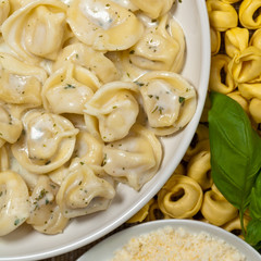 Tortellini with Basil Cream Sauce. Selective focus.