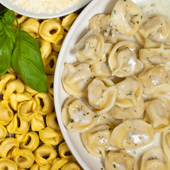 Tortellini with Basil Cream Sauce. Selective focus.