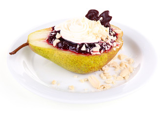 Tasty dessert with pear, cream and berry sauce