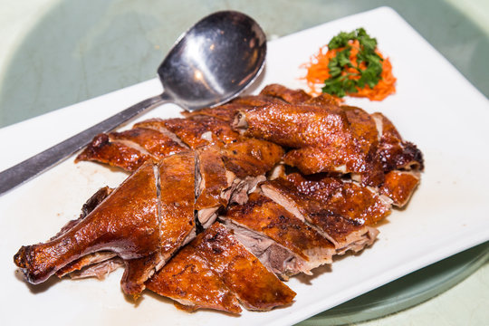 Chinese style roast duck served on plate