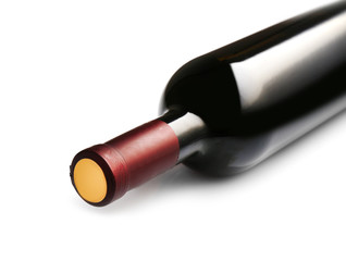 Lying red wine bottle, isolated on white