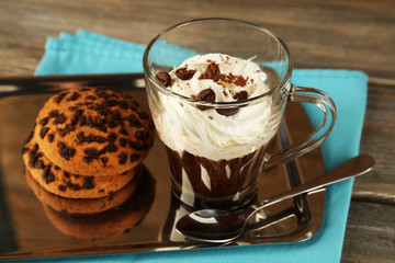 Cup of coffee with cream and cookies