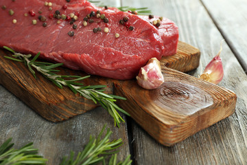 Raw beef steak with rosemary and garlic