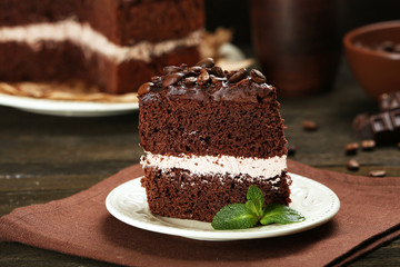 Delicious chocolate cake on table close-up
