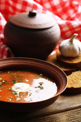 Ukrainian beetroot soup - borscht in bowl and pot,