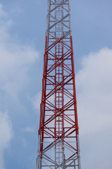 Fototapeta na wymiar Telephone pole on blue sky background.