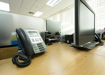 table work in office with telephone and computer pc