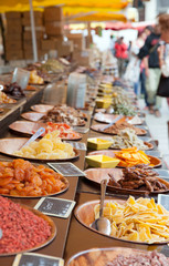 The full of dried fruits grocery counter on market place
