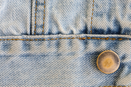 jeans denim clothing with metal button on clothing textile