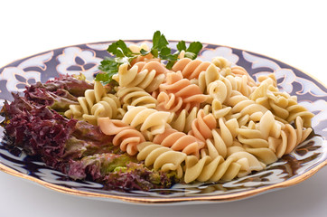 Penne pasta with sauce, cheese and basil, selective focus