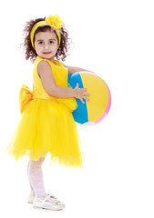very beautiful little girl in a yellow dress