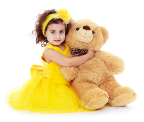 Cheerful caucasian girl in a yellow dress
