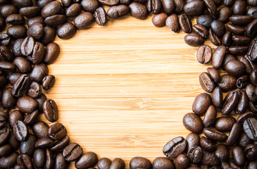 Coffee bean on the wood  background