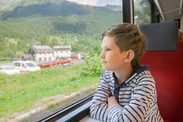 the child is traveling in a train