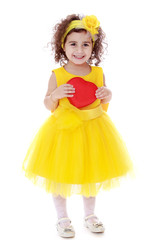 elegant little girl in a yellow dress