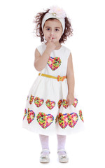 Cute beautiful little girl in a white dress.