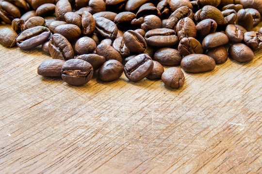 Coffee bean on the wood floor