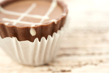 Dark chocolate on wooden background