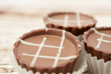 Dark chocolate on wooden background