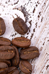 Coffee beans on wood background