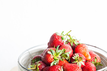 Fresh Organic Long Stem Strawberries in a Bowl.