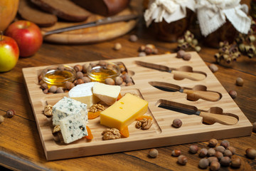 Cheese platter with various cheeses.