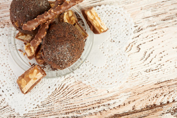 Cupcake with chocolate on wooden background