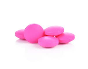 Obraz na płótnie Canvas pink pills on a white background