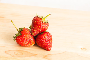 Fresh strawberry on wood.