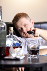 lazy man flips channels on tv