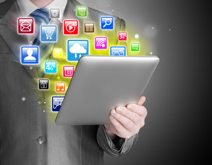 Business man use tablet pc with colorful application icons