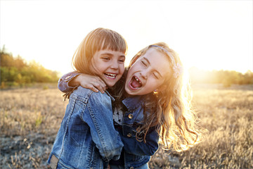Two young girls have fun outside
