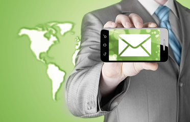 A man holding smartphone with one new message on a screen