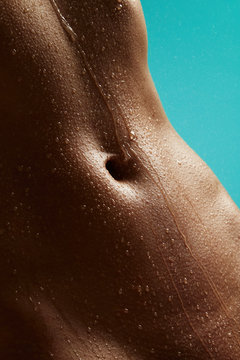 Beautiful woman's body with drops of water
