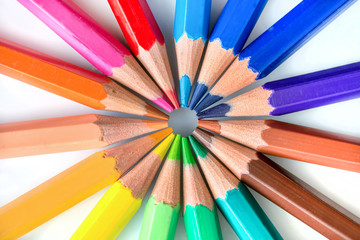 Colorful pencils in circle on white background
