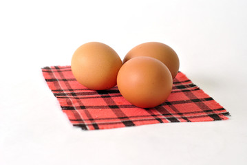 Fresh eggs on a checkered napkin